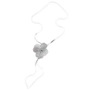 Detailed macro view of a silver floral pendant necklace with intricate mesh texture petals