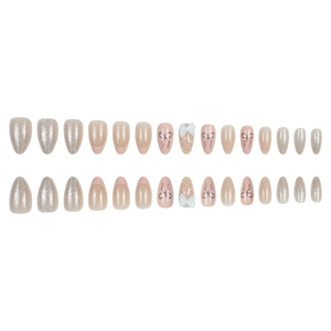 French style press-on nails in sweet pink with 3D bow accents and silver glitter finish