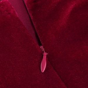 Macro shot of seamless invisible zipper detail on premium burgundy velvet evening dress