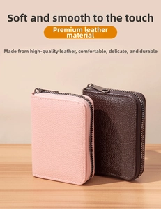 Detail of pink and brown leather card holders with lychee texture and metal zippers