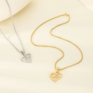 Detail of heart-shaped Mom pendant with pavé crystals and polished silver finish