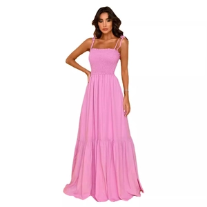 Elegant high-waist pink maxi dress with smocked bodice and adjustable straps