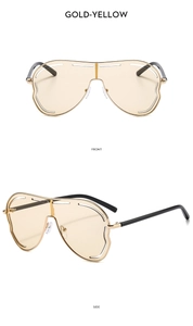 Détail de lunettes de soleil masque jaune doré avec verres ondulés et vue de profil