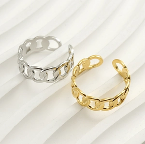 Detail of adjustable chain link rings in gold and silver finish with polished surface