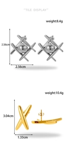 Detail view of geometric cross earrings in gold and silver with dimensions and weight