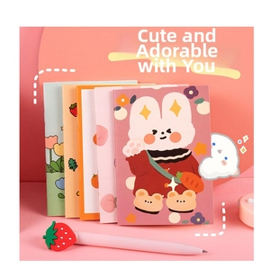Detailed view of pink cartoon mini notebook set with cute bunny illustrations and a matching pen