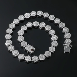 Macro detail of silver hexagonal link necklace with full diamond settings and box clasp