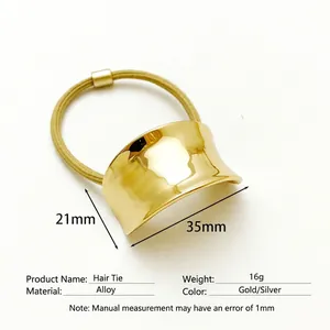 Minimalist golden alloy hair tie with curved metal plate for elegant ponytail styling