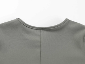 Close-up of the reinforced crew neck and fine knit texture of this grey fitness t-shirt