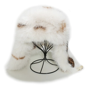 Detail view of winter earflap hat featuring faux fox fur texture and leopard print lining
