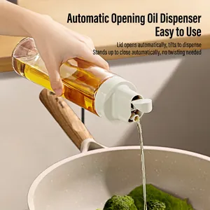 Gravity-fed glass oil dispenser bottle with automatic opening lid for precise pouring
