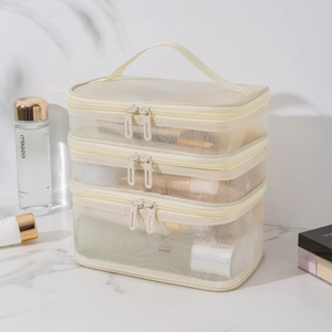 Neceser de malla beige de tres capas con cremalleras dobles y asa de transporte