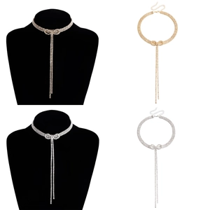 Sparkling bow choker necklace with long rhinestone tassels in gold and silver finishes