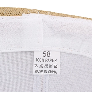 Detail view of woven straw hat interior featuring white sweatband and size 58 label