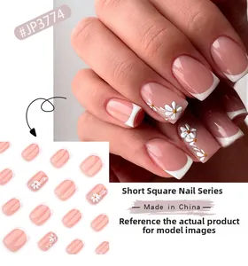 Short square press-on nails with white French tips and detailed 3D daisy flower art