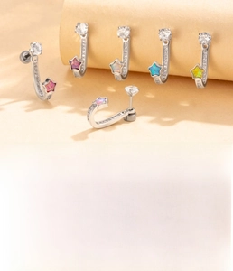 Detailed shot of titanium steel U-shaped star earrings with colorful opal stone inserts