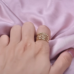 French retro gold 304 stainless steel layered hollow ring on lavender silk background