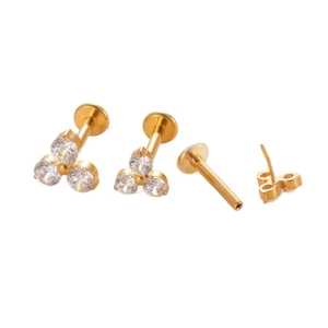 Titanium flower labret stud with three cubic zirconia stones in golden finish