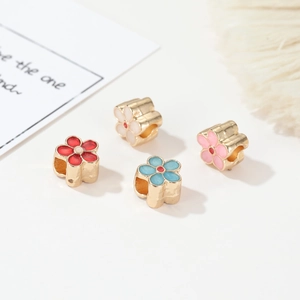 Pastoral style cherry blossom beads in red blue pink and white with gold enamel