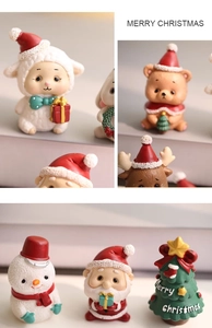Close-up detail of resin Christmas tree, snowman and reindeer miniature ornaments