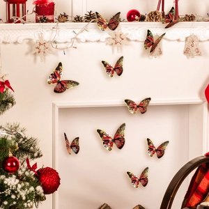 Detail of red and gold 3D butterfly wall stickers on fireplace with Christmas decor