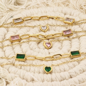 Double-layered gold necklace with pink heart and green rectangular zircon pendants