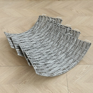 Gray woven Christmas tree base collar with willow texture and hook fasteners on wooden floor