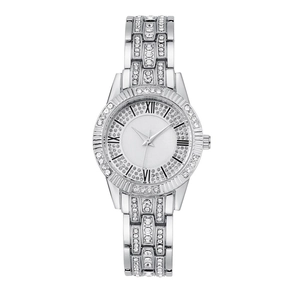 Close-up of women's silver watch featuring a rhinestone bezel and marble-textured dial