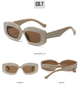 Three-way display of khaki cat-eye sunglasses with silver rhinestones and brown lenses
