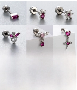 Detailed views of silver surgical steel stud earrings with red and pink heart zircons