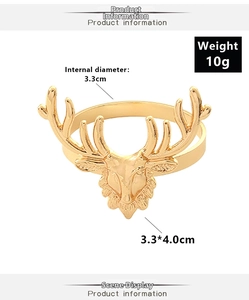 Detail showing gold elk napkin ring dimensions: 3.3cm diameter and 4.0cm height