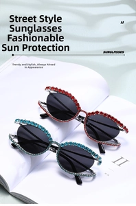 Close-up of luxury Y2K cat-eye sunglasses with rhinestone edges in red and blue colors