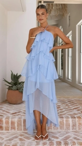 Close-up of sky blue multi-layered ruffled halter dress with asymmetrical chiffon hem