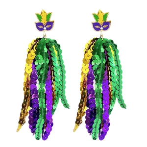 Detail of carnival earrings with gold, purple and green sequins tassels and mask motif