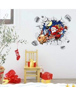 Detail view of 3D Christmas wall sticker with Santa and reindeer on a white living room wall