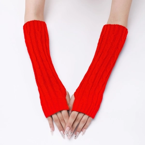 Detailed knit texture of red cable-knit arm warmers for men and women in winter
