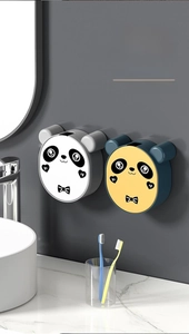 Wall-mounted panda soap holder with punch-free design and drainage in a modern bathroom