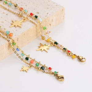 Double-layered gold chain bracelet with colorful beads and octagonal star pendants