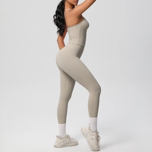 Side view of two-piece fitness set with high waist leggings and thin strap sports top