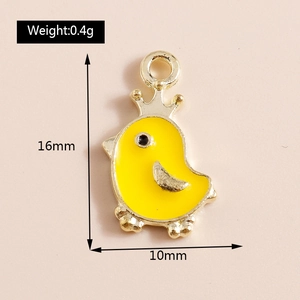 Macro detail of yellow enamel chick pendant with 16mm height and 10mm width dimensions
