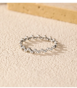 Macro detail of S925 sterling silver beaded ring with irregular vintage finish