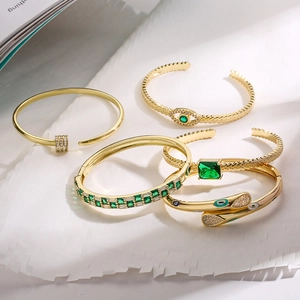 5-piece gold-plated geometric bracelet set with green gemstones and zircon detailing