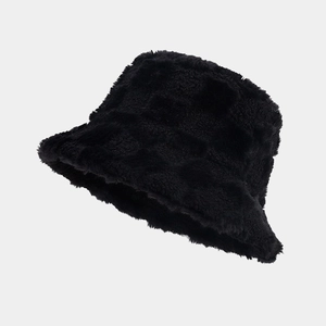 Detailed view of the checkered pattern on black plush winter bucket hat for warmth