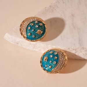 Vintage gold star and moon planet earrings with blue enamel and sparkling crystals