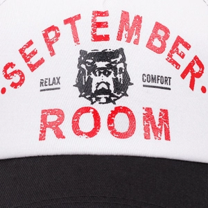Close-up of bulldog graphic and red vintage text on a white cotton baseball cap