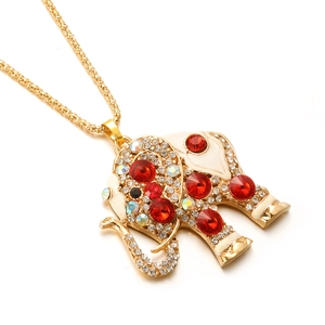Golden elephant pendant necklace with red rhinestones and white enamel on long chain