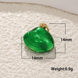 Macro detail of a 14mm green shell-shaped 14k gold plated koi charm with dimensions