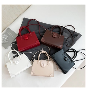 Detailed overhead view of tote bags in five colors with crocodile texture accents