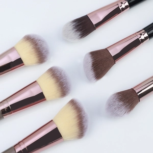 Close-up of dual-ended makeup brush set with gradient bristles and rose gold ferrule