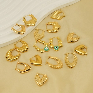 Detailed collection of 18K gold plated hoop earrings with green enamel evil eye charms